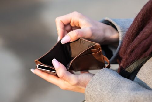 person opening empty wallet